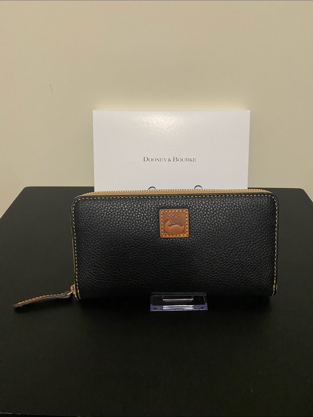 Dooney & Bourke Black Pebbled Leather Zip Wallet with Brown Logo Patch